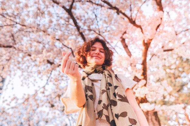 Spring positive emotions emotions of love of young girl in blooming garden