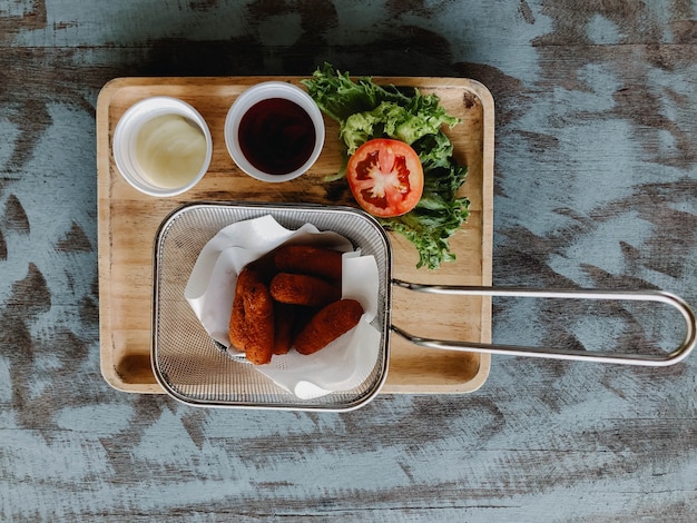 Spring rolls on rustic wooden table