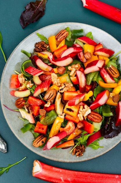 Spring salad with rhubarb greens and nuts