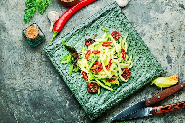 Spring vegetable salad.Salad of fresh zucchini, peppers and garlic