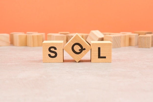 Sql wooden blocks word on orange background information concepts