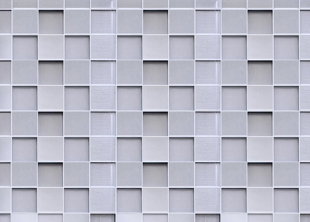 Photo square pattern background of expanded aluminium grating decoration on exterior building wall