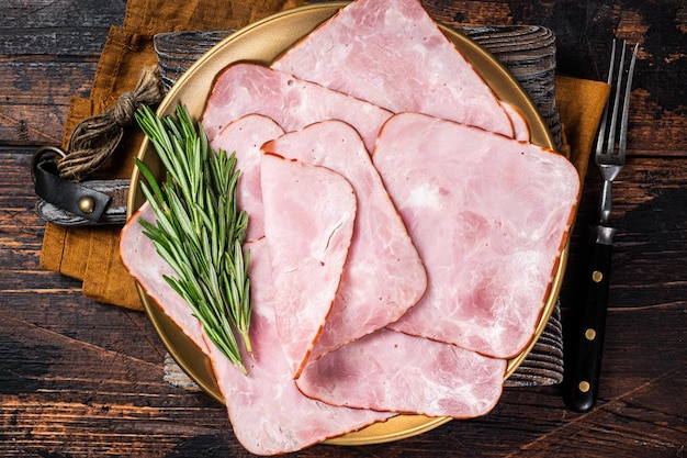 Square Sliced pork meat ham on plate Wooden background Top view