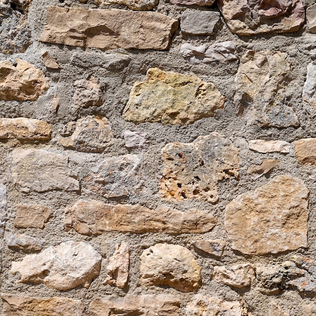 Square stone wall stone beige background of house brick horizontal stones wallpaper