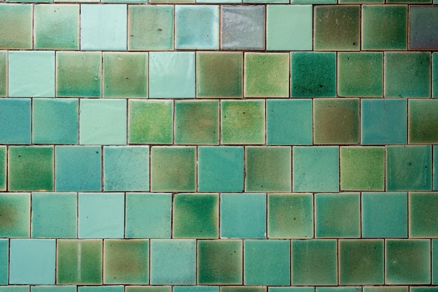 Square tile pattern arranged in a grid in blue-green tone