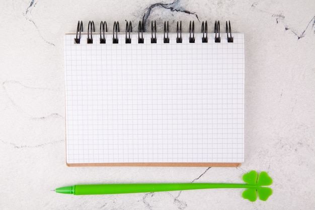 Squared notebook on a white background, decor for St. Patrick's Day.