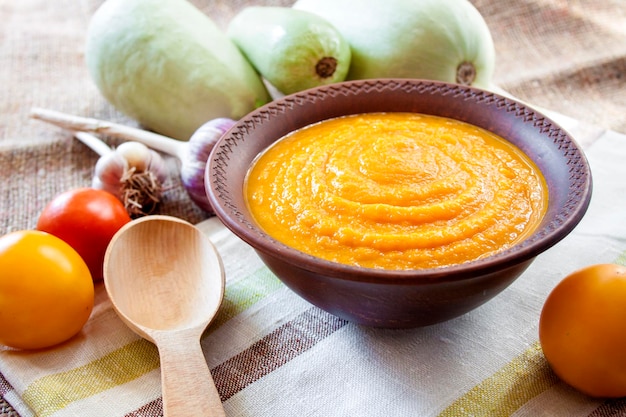 Squash caviar with garlic and tomatoes in a rustic bowl