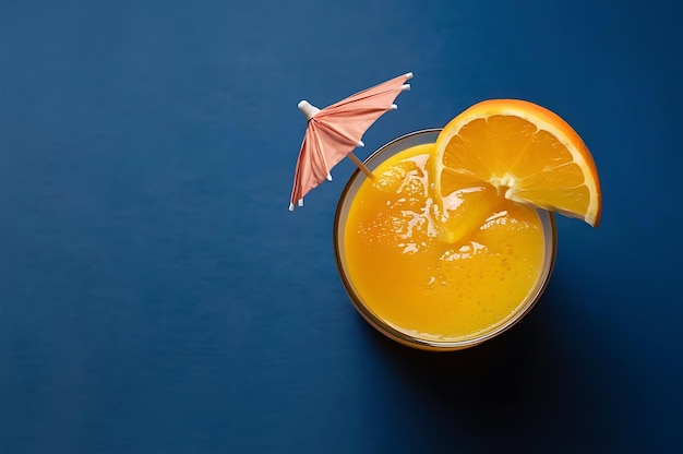 Squeezed orange juice garnished with orange slice on blue background