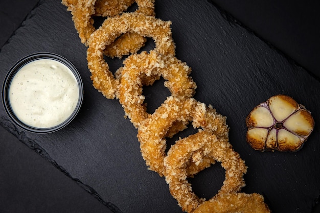 Squid rings in batter with sauce