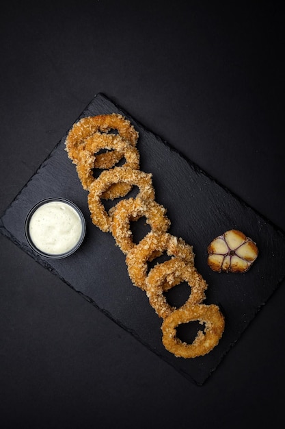 Squid rings in batter with sauce