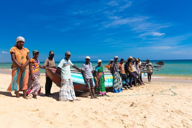 SRI LANKA Mach 23 Local fishermen pull a fishing net from Indian Ocean on Mach 23 2017 in Kosgoda Sri Lanka Fishing in Sri Lanka is the way they earn their living