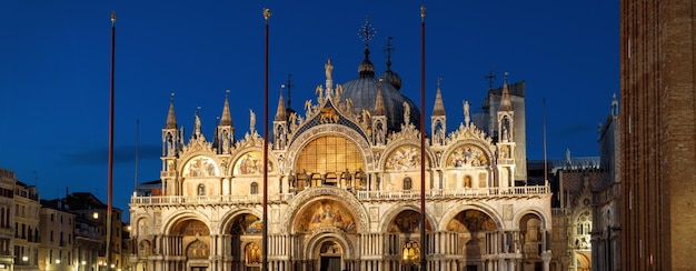 St Marks basilica or San Marco at night Venice Italy Medieval basilica is top landmark of Venice Panoramic view of facade