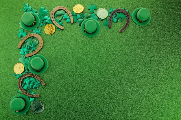 St patricks day corner border of shamrocks gold coins and leprechaun hat