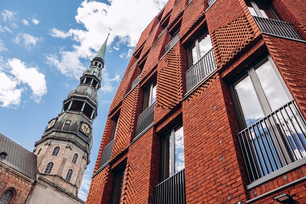 St. Peter's tower wide angle. Sunny weather with blue sky. St. Peter's Church in the historical center of Riga. Latvia