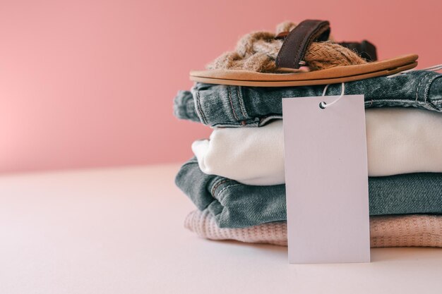 Photo stack of baby clothes with baby shoes advertising style and fashion