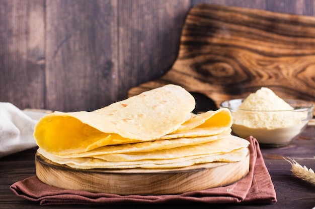 A stack of baked mexican tortillas on a board on the table Homemade pastries