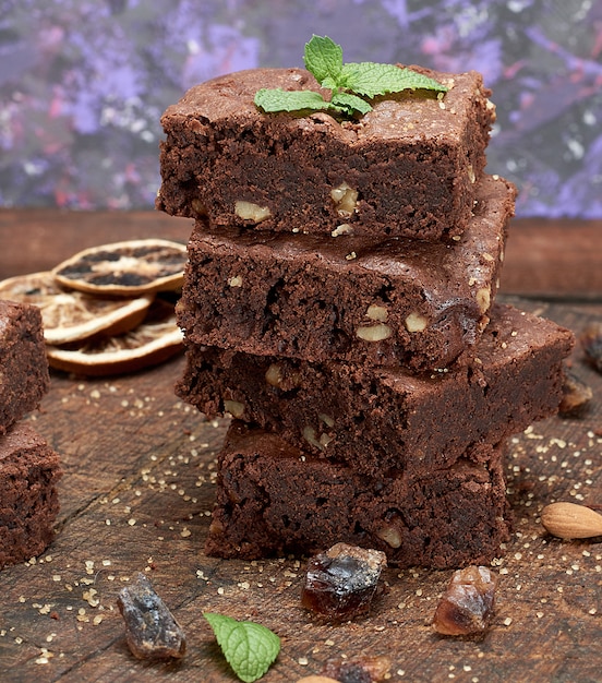 Stack of baked square pieces of brownie pie