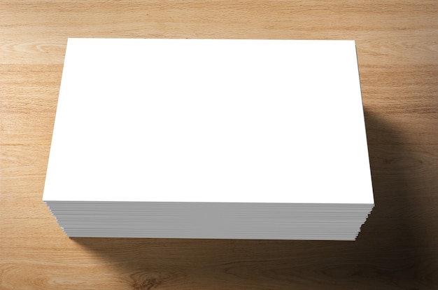 Stack of blank name cards on wooden background