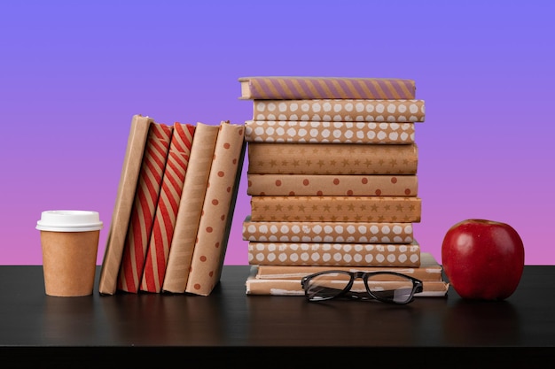 Stack of books on black wooden table