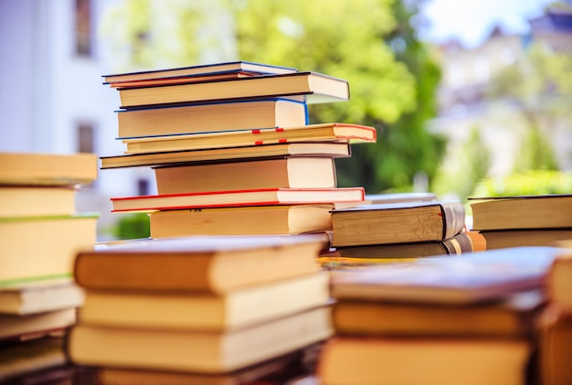 Stack of books at a charity book flea market text space