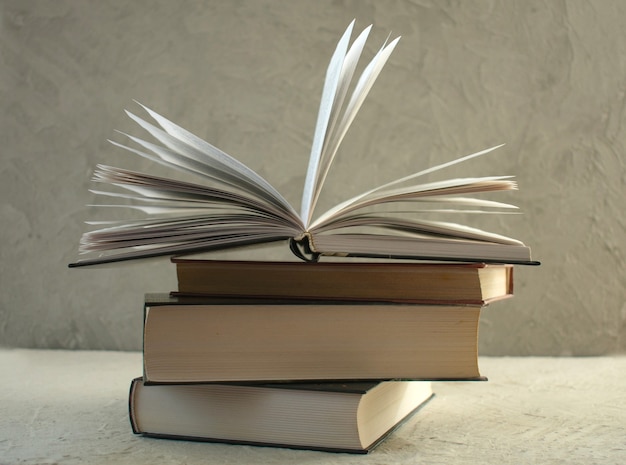 Stack of books on a gray background Closeup