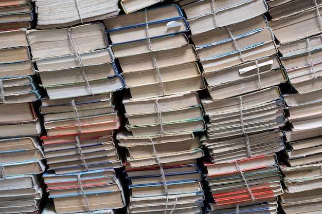 Stack of books in library Book texture Different vintage books in row Literature reading concept