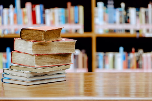 Stack of books in the library.Education concept Library with many shelves and books