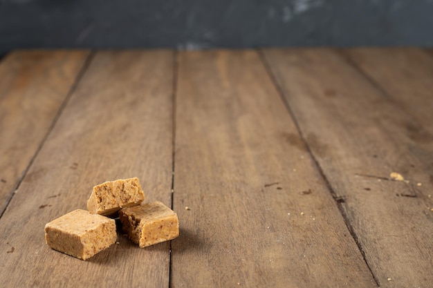 Stack of Brazilian Peanut Sweet called pacoca on a wooden desk