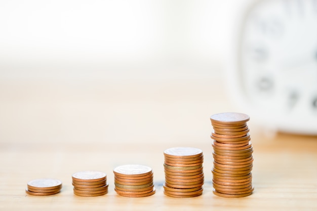 Stack of bronze coins stack on each other in shape of increasing graph