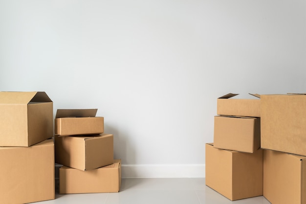 Stack of cardboard boxes in empty room