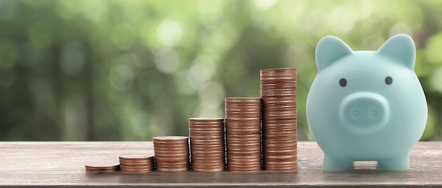 Stack of a coin with trading graph, financial investment concept. and Piggy bank