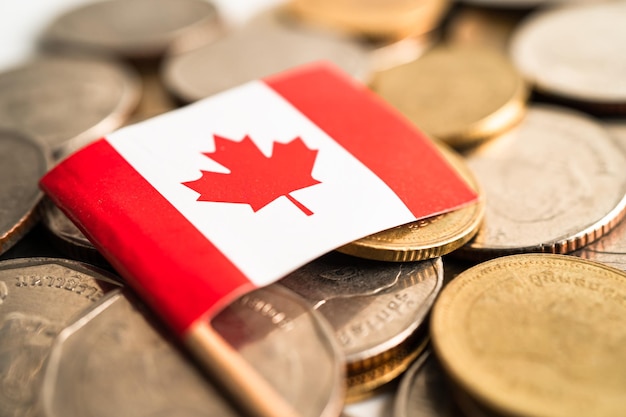 Stack of coins money with Canada flag finance banking concept