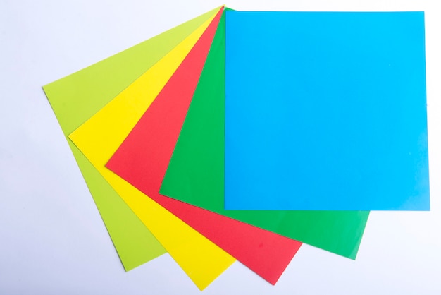 Stack of colored paper on white background