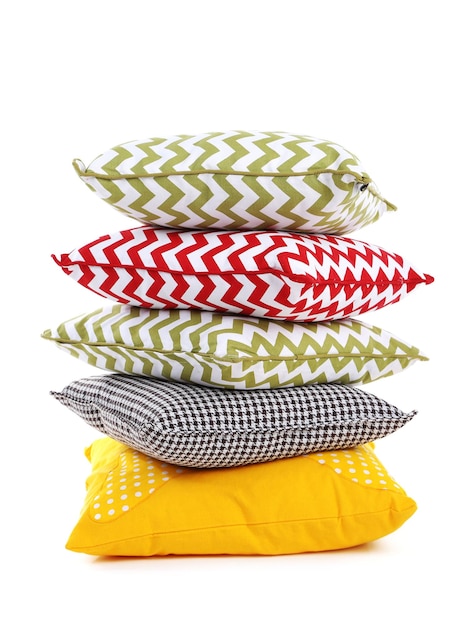 Stack of colorful pillows isolated on white