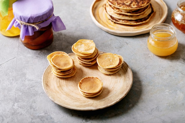 Photo stack of delicious mini pancakes on plate