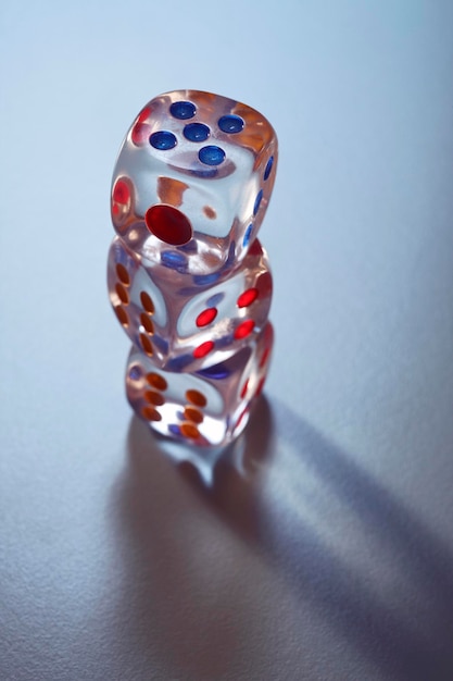 stack of dice against gray background