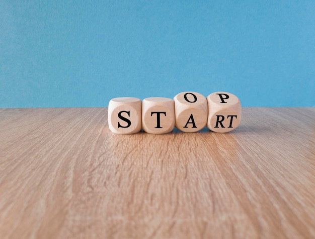 A stack of dice with the word start on it