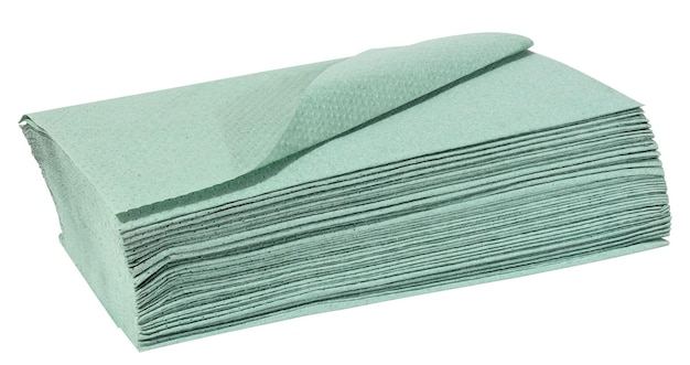 Stack of disposable green paper tissues for face and hands isolated on white background