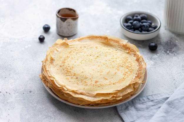 Stack of freshly baked thin pancakes, crepes