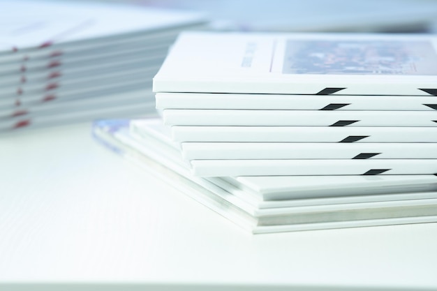 Stack of freshly printed photobooks on the table closeup