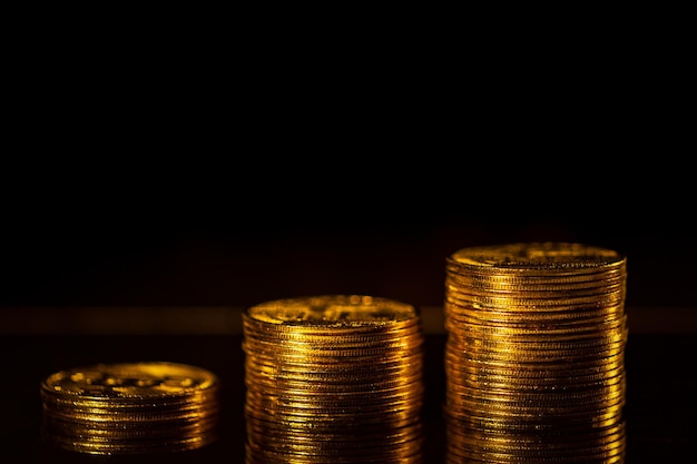 Stack of gold coins with dark background