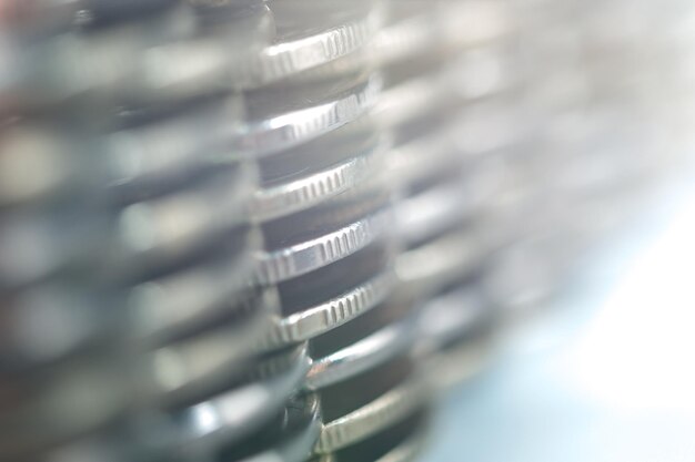 Stack of golden coins macro. Rows of coins for finance and banking concept. Economy trends background for business idea and all art work design. Closeup, Shallow depth of field.