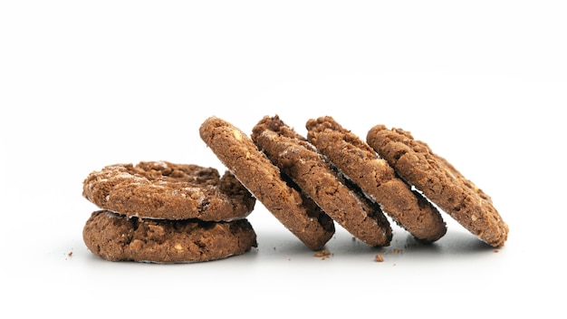 Stack of homemade chocolate cookies on white.