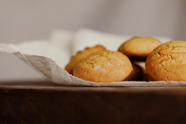 Stack of homemade cookies on wooden board. Baking in country kitchen.