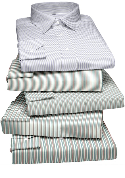 Photo a stack of linens with a striped shirt on top