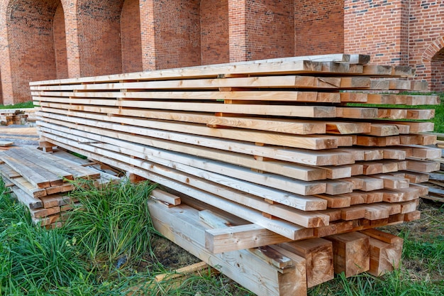 A stack of lumber is stacked on top of each other.