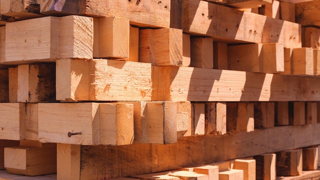 Stack of many timbers from the old wood pallets are taken apart for reusable and recycling concept