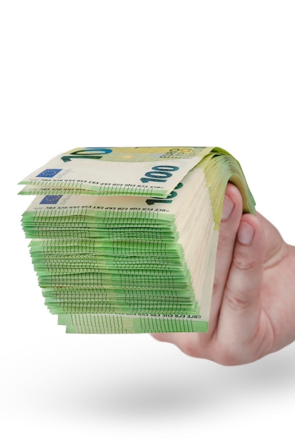 Stack of money in hand isolated on white background 100 euro banknotes in a man's hand A man holds out his hand with a stack of banknotes as a concept for a loan insurance or mortgage