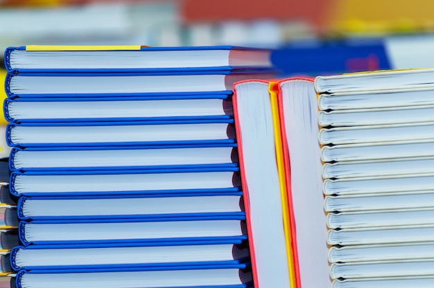 Photo stack of new books on the table. books on the forum of manufacturers of printed products.