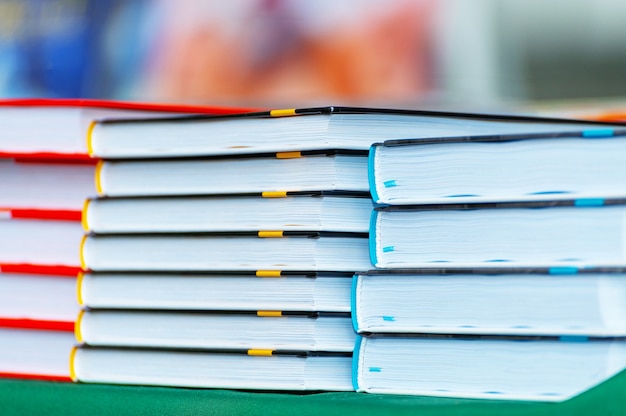 Stack of new books on the table. Books on the forum of manufacturers of printed products.